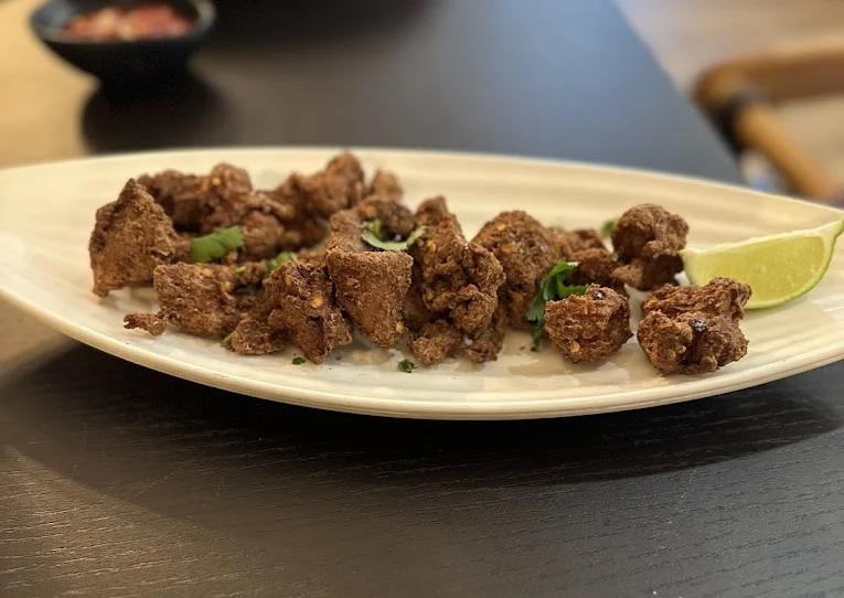 Persian lamb shank with baghali polo fava bean dill rice at Tehran Cafe Winnipeg